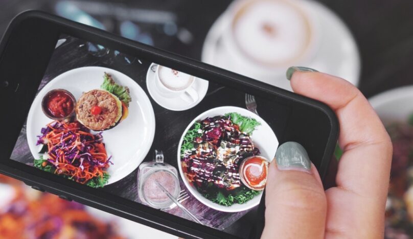 Picture of food on phone stock image