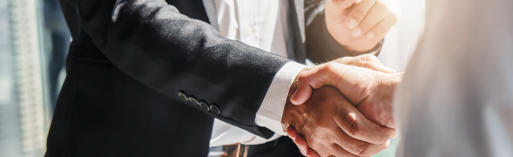 Two people shaking hands. Freshfield has the perfect blend of mergers and acquisitions PR expertise to advise organisations throughout the whole process.